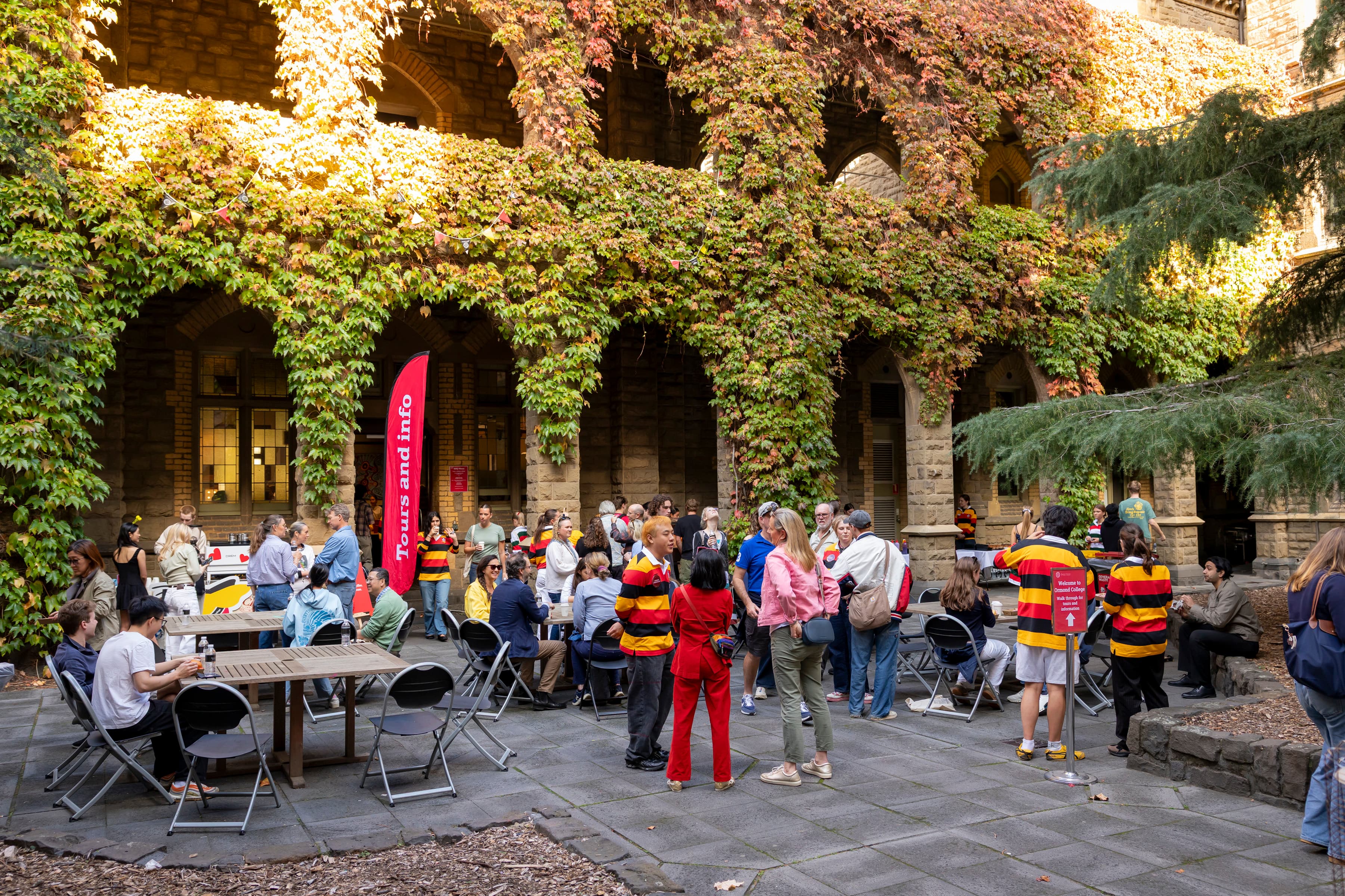 Ormond students, staff and visitors mingling in the Ormond College Quadrangle at Open House.